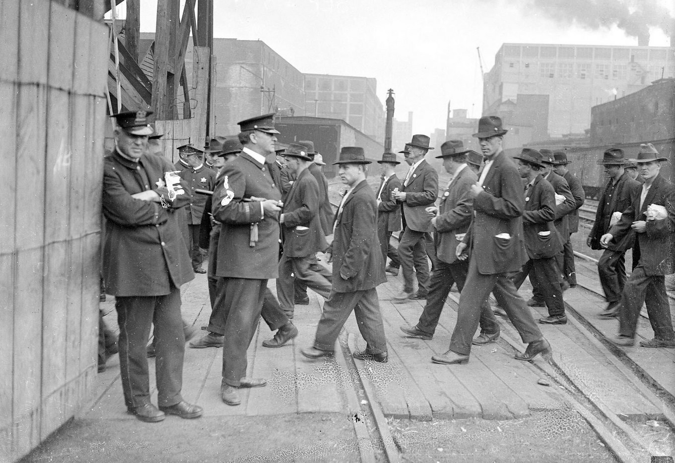 #51 Packinghouse workers during their walkout, crossing train yards, Chicago, Illinois, 1919.