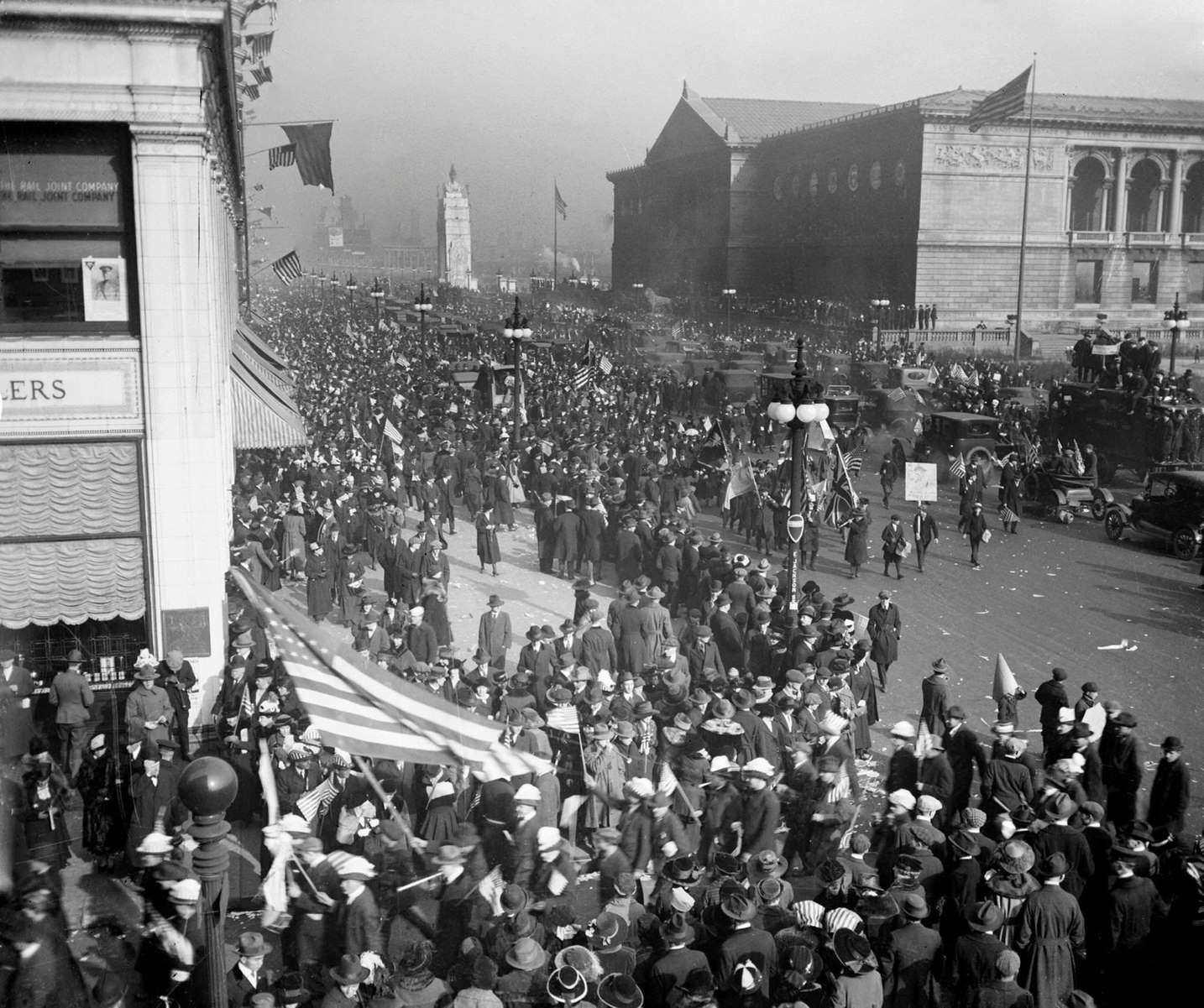 #16 Crowds at the Armistice Day peace celebration marching in front of the Art Institute at 111 South Michigan Avenue in the Loop community area of Chicago, Illinois, 1918.