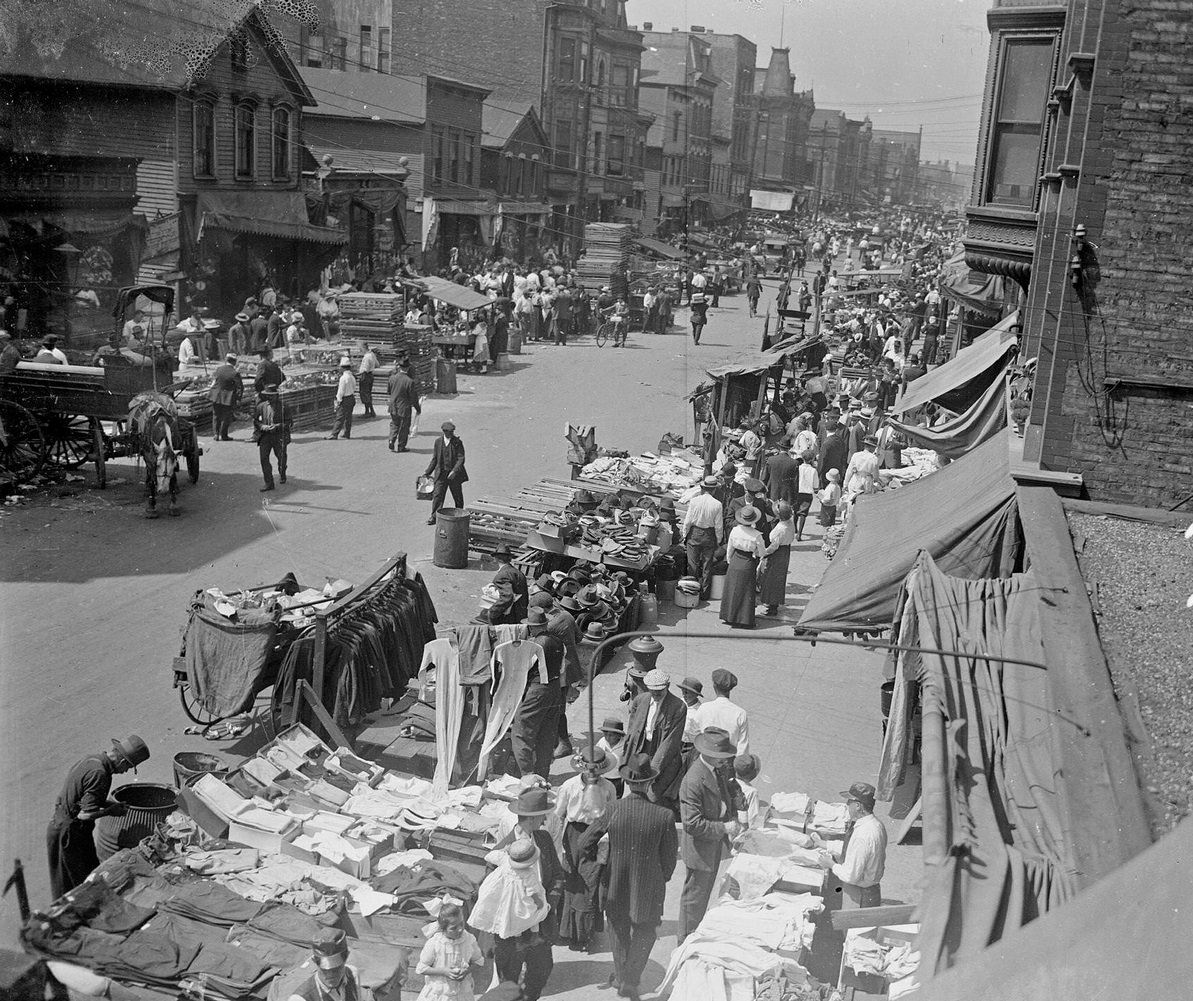 #61 Clothing merchants selling goods along Maxwell Street, probably during the Sunday market, Chicago, Illinois, 1917.