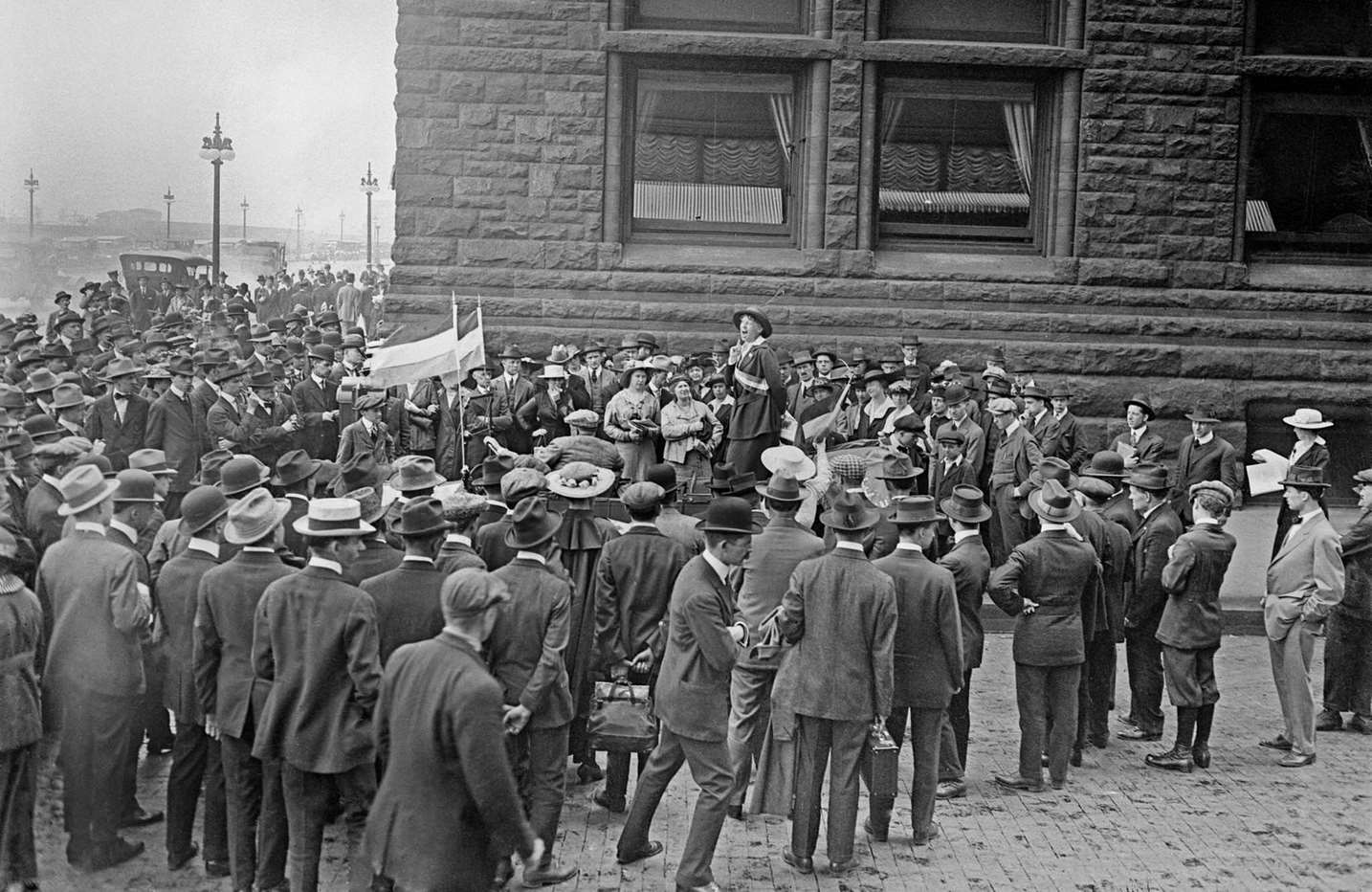 #76 Mabel Vernon, a suffragist, speaking to a crowd on the corner of East Van Buren Street and South Michigan Avenue in the Loop community area of Chicago, Illinois, 1916