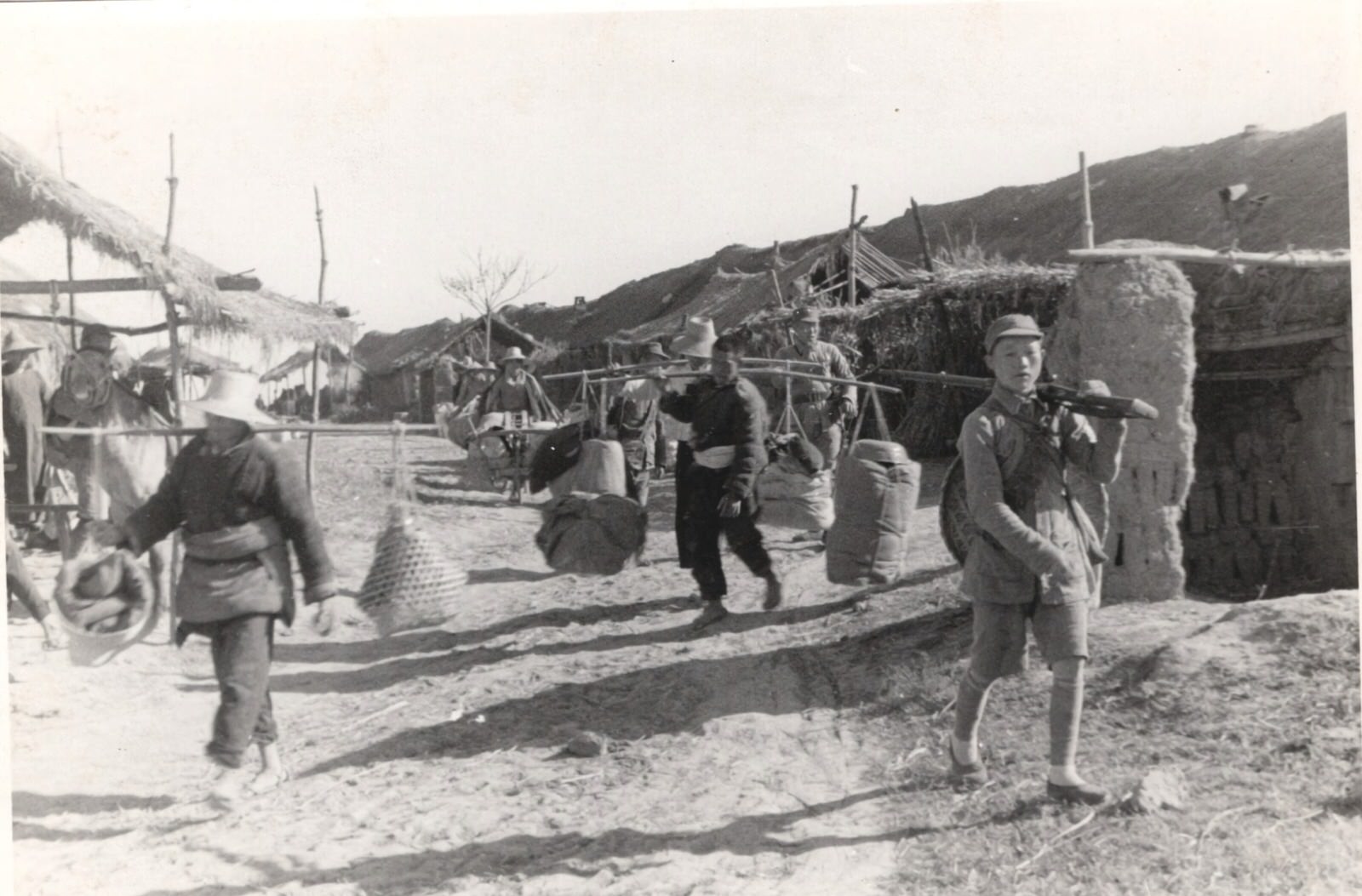 #29 The paths of Central China are filled with men and animals carrying ammunition up to the front. 1937-1940