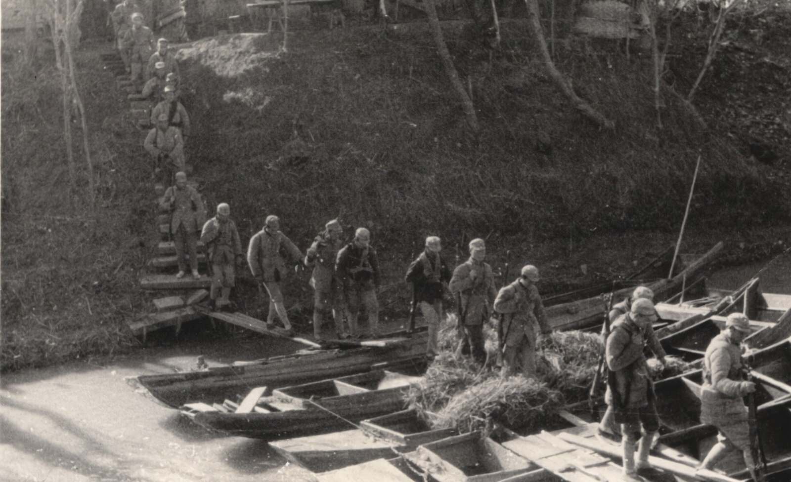 #34 A column of men of the New 4th Army Storm Guerrilla cross streams on boats. 1937-1940