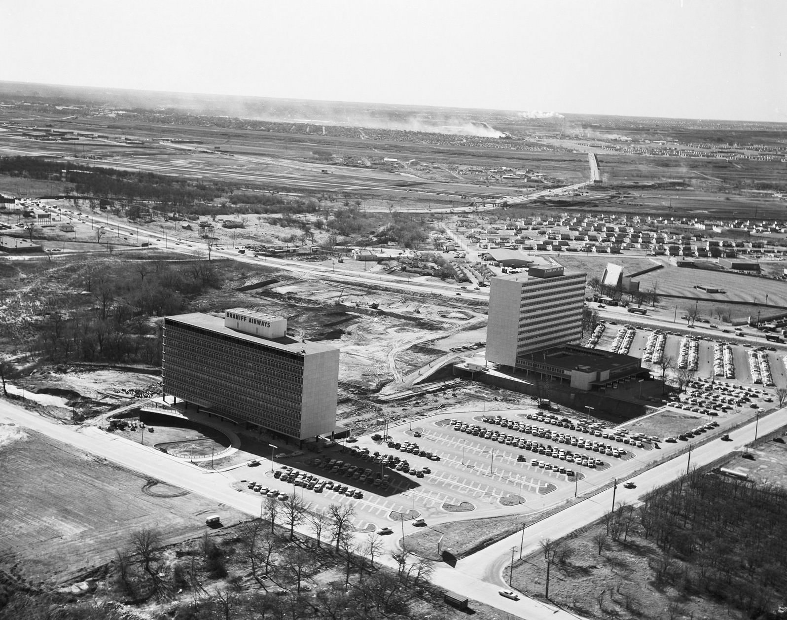#214 Braniff Airways and Exchange Bank buildings with Dallas Love Field, 1950