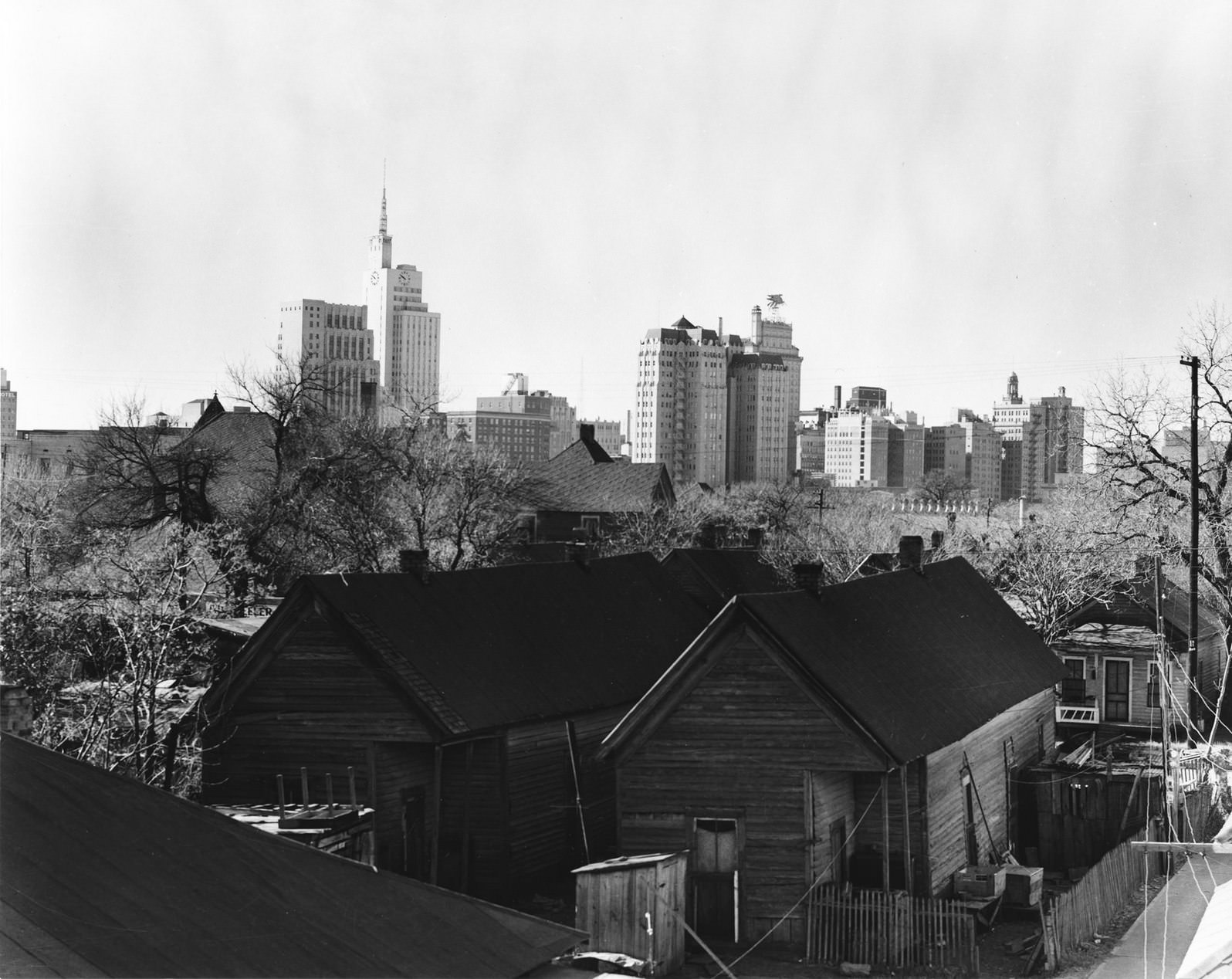 #248 Skyline of downtown Dallas, Texas from the backyards of tenement houses, 1950