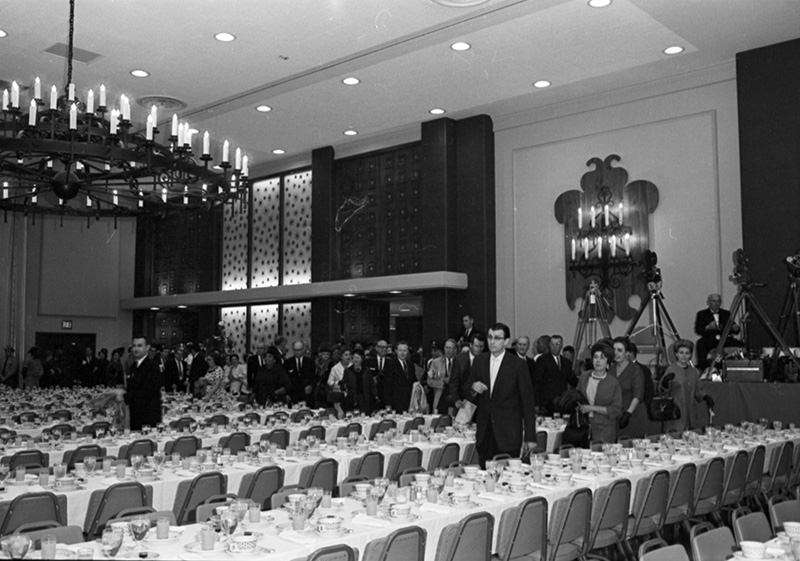 #123 People entering Hotel Texas Grand Ballroom with tables set for breakfast for President John F. Kennedy and party, 1963