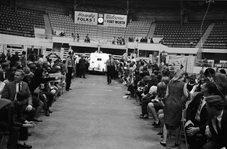 #124 Rolling Stones rock group arrives in armored car inside Will Rogers Coliseum for a concert in Fort Worth, Texas, 1960s