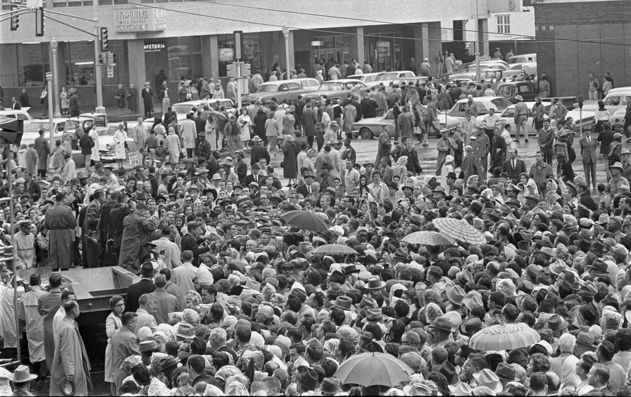 #130 Overhead view of large crowd outside Hotel Texas, 1963