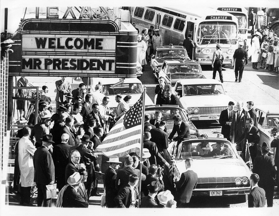 #131 President John F. Kennedy and Jackie Kennedy in presidential limousine with Texas Governor John Connally, outside Hotel Texas, Fort Worth, 1963