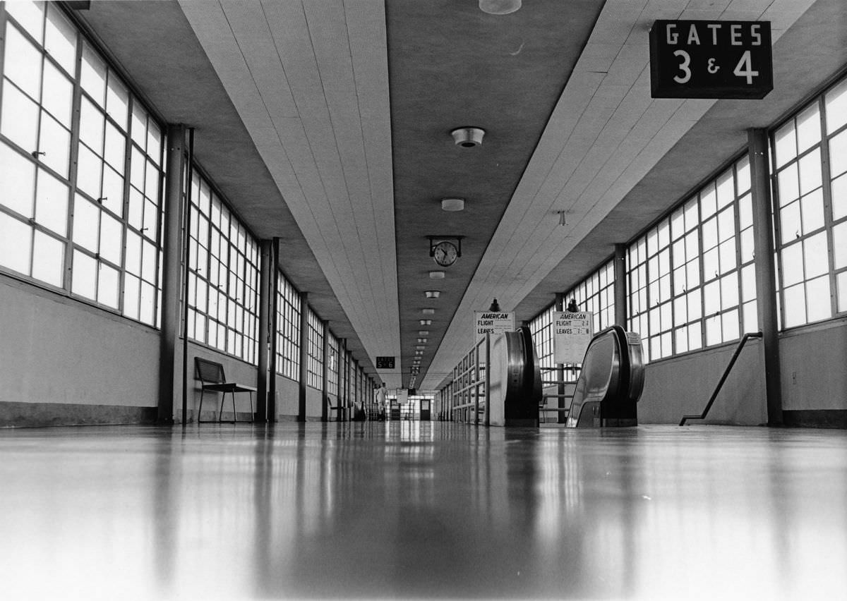 #70 Greater Southwest International Airport concourse, Gates 3 and 4 with escalators to American flights, 1968