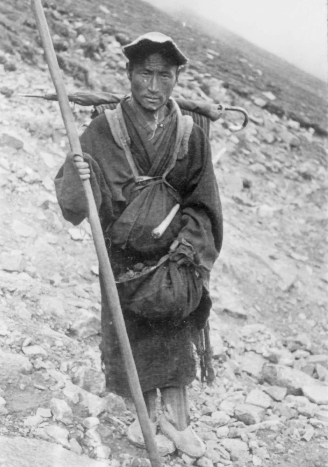 #16 A Tibetan Monk, 1944. A Tibetan monk on pilgrimage. He carries a spear.
