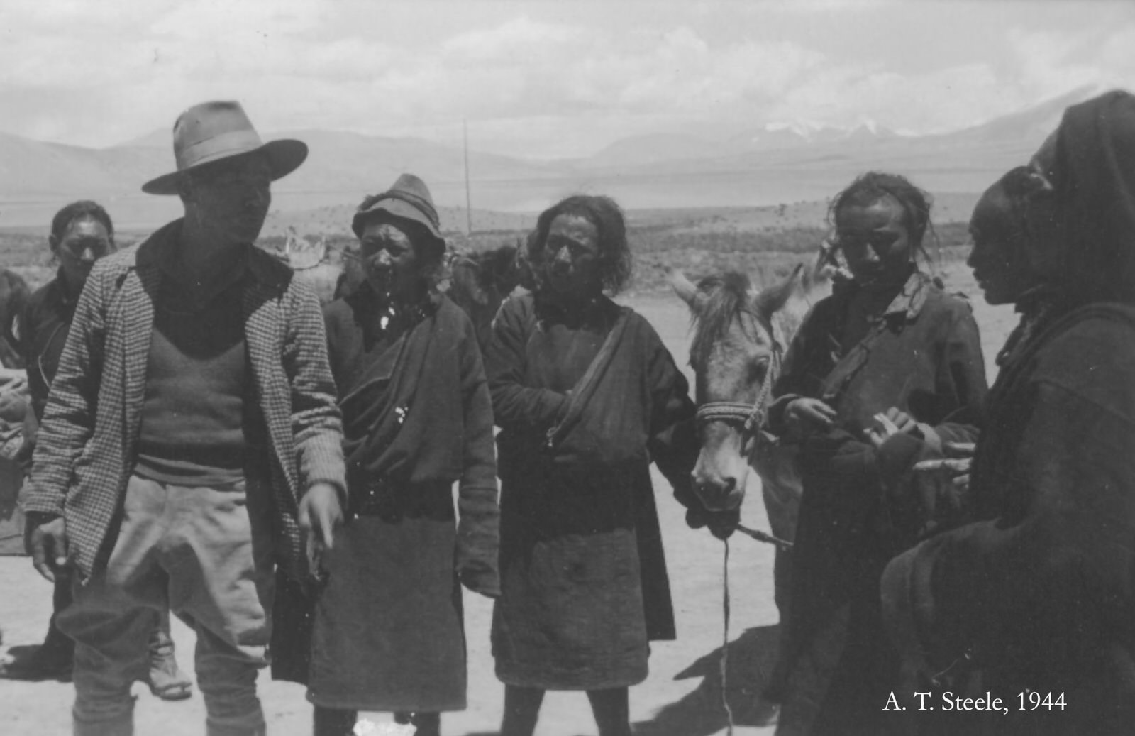 #22 Tibetan Servant Pa-sang, 1944. My Tibetan servant Pa-sang (“Friday”), with friends.