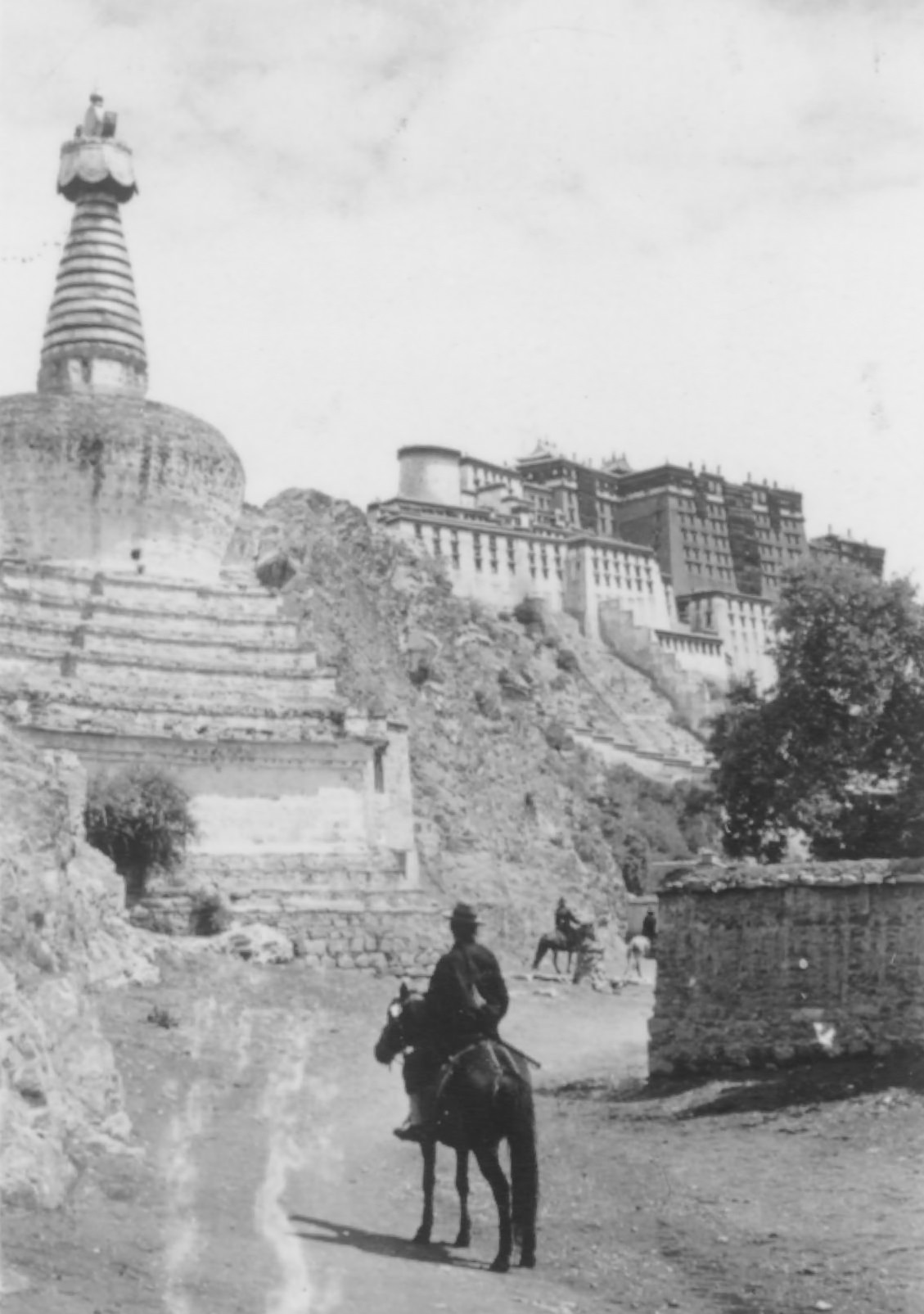 #35 Buddhist Monument, Chorten, 1944. Buddhist monument, chorten, with Potala in the background.
