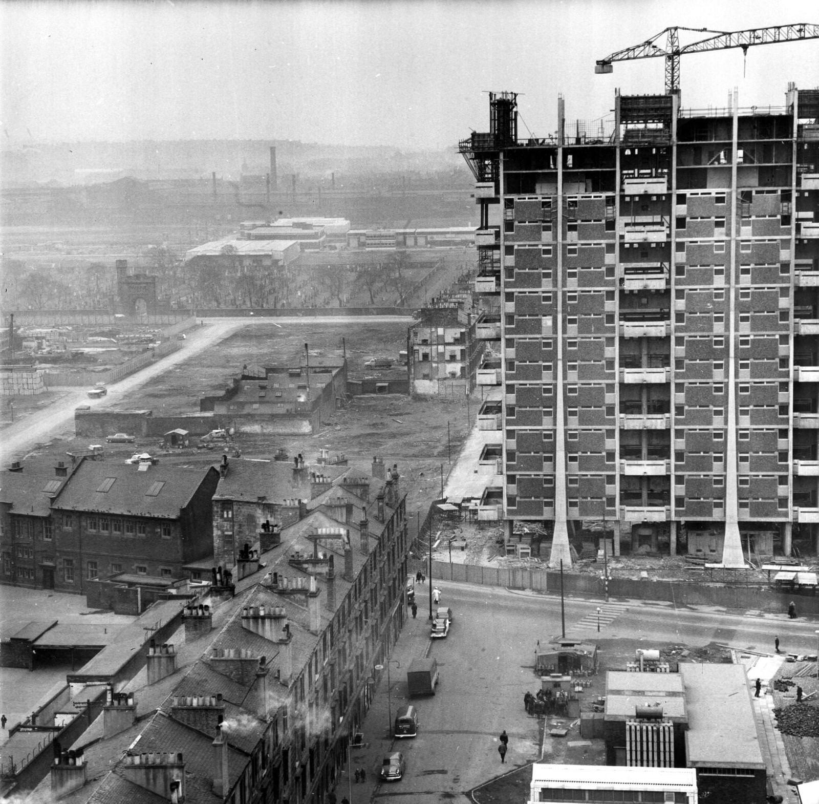 #16 Modern housing under construction beside old tenements in the Gorbals area of Glasgow, 1960