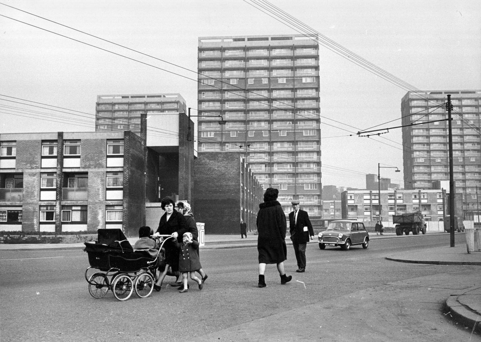 #6 People walking past newly-built tower blocks in the Gorbals area of Glasgow, 1960