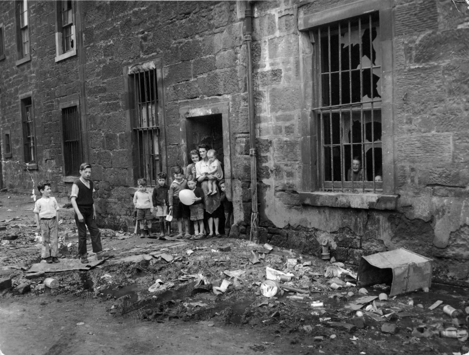 #26 The Surrey Lane entrance to Nicholson Street flats, in the Gorbals, the notorious slum district of Glasgow, 1956
