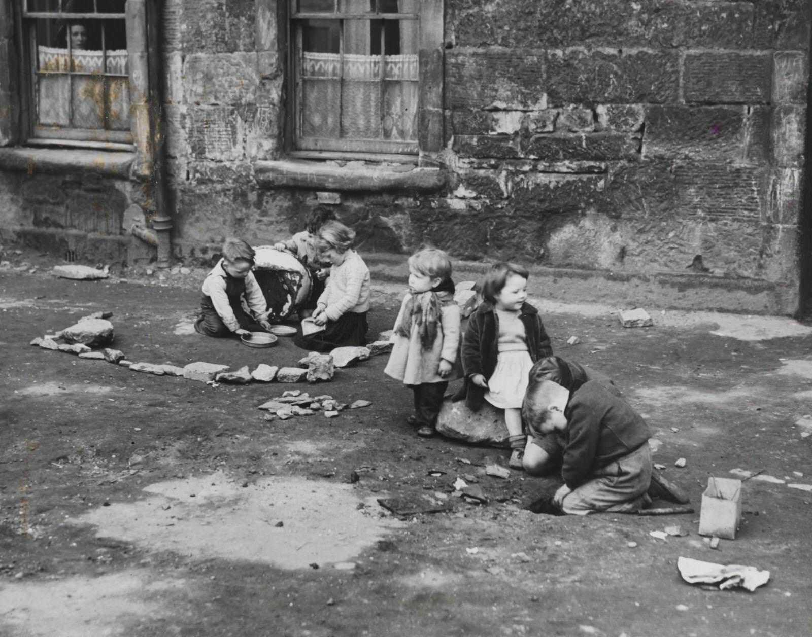 #30 Slum children at play, 1952