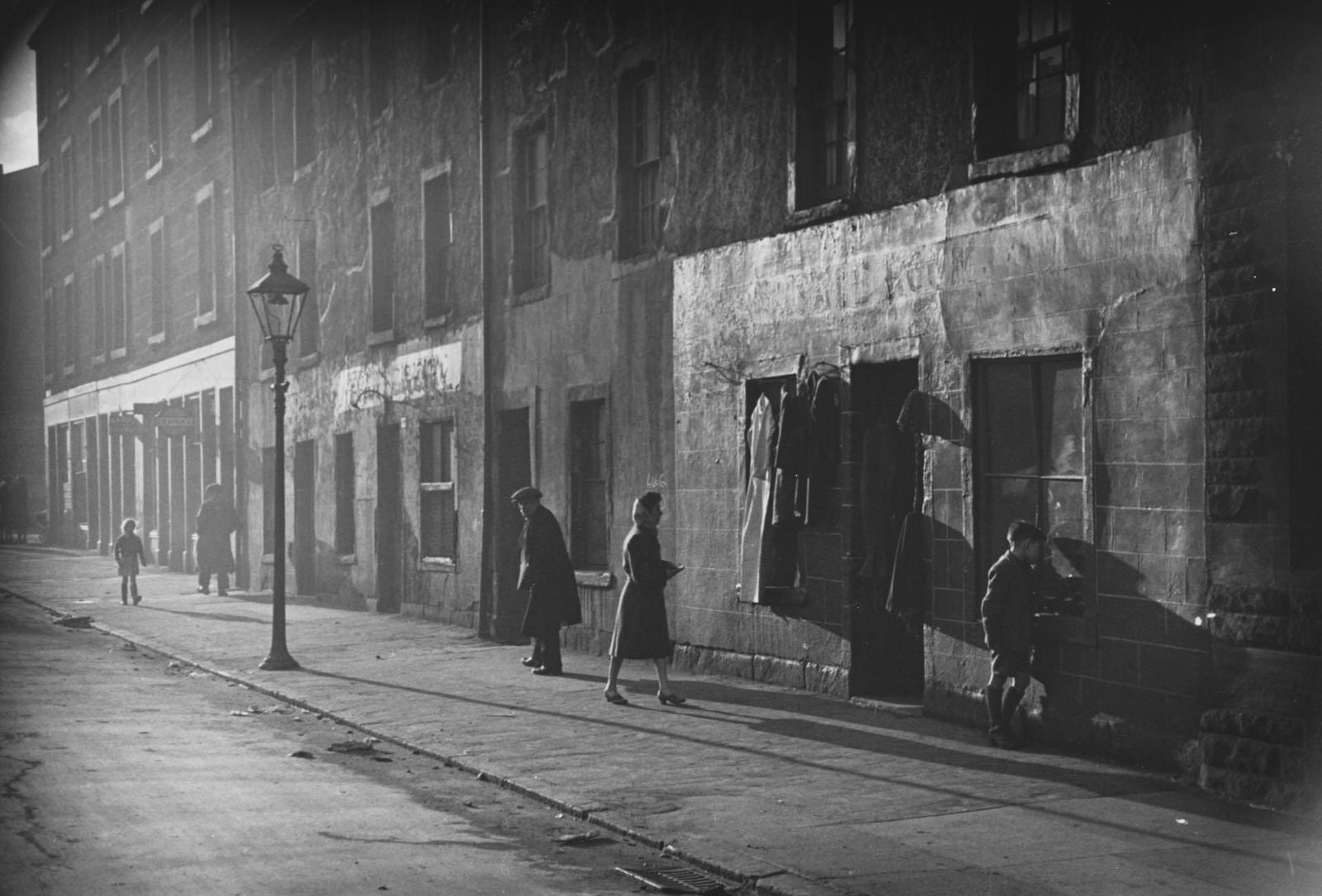 #44 A second hand clothing store in the Gorbals area of Glasgow, January 1948.