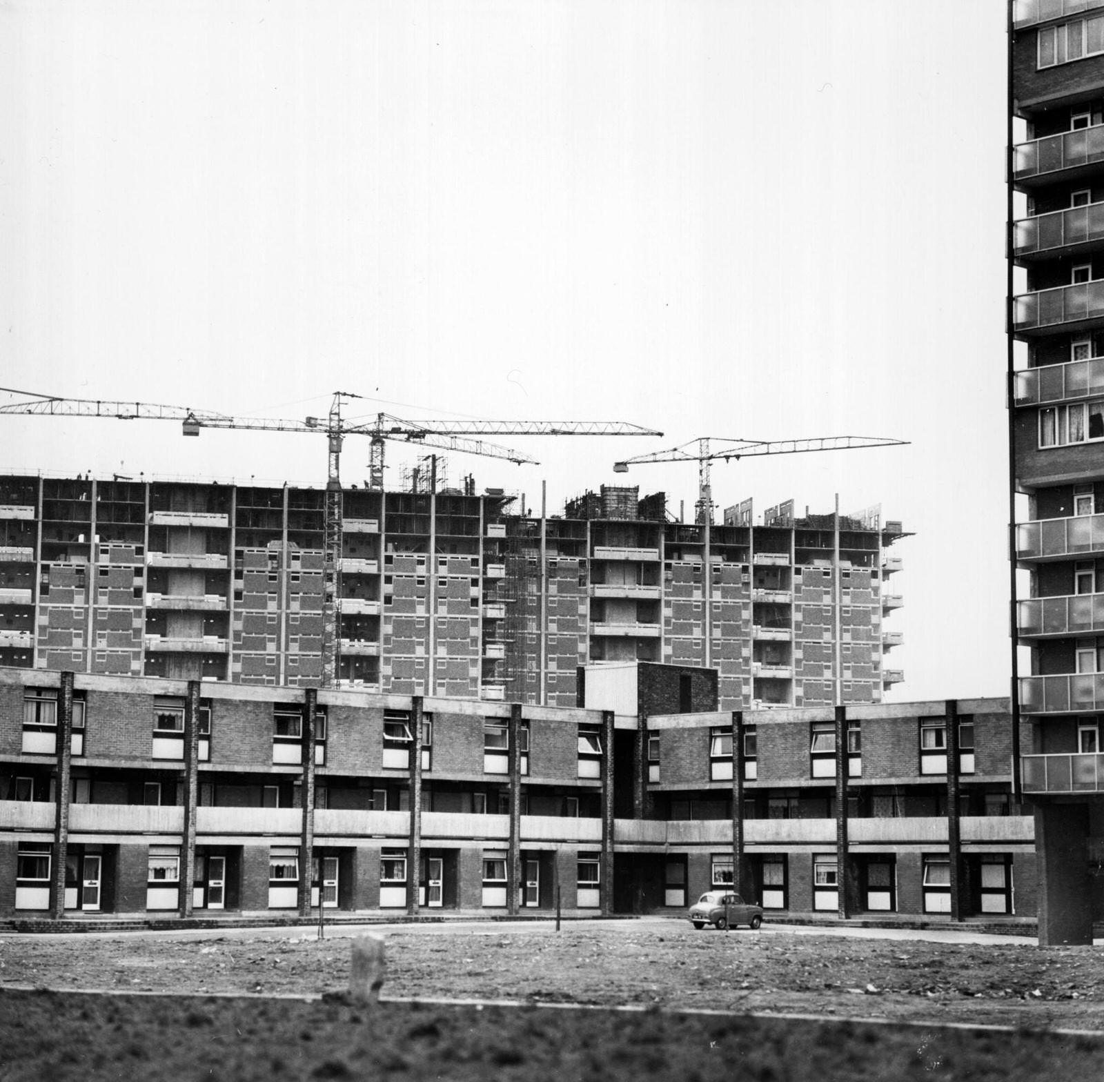 #4 A woman and a little girl walking through an area of modern housing in the Gorbals area of Glasgow, 1960