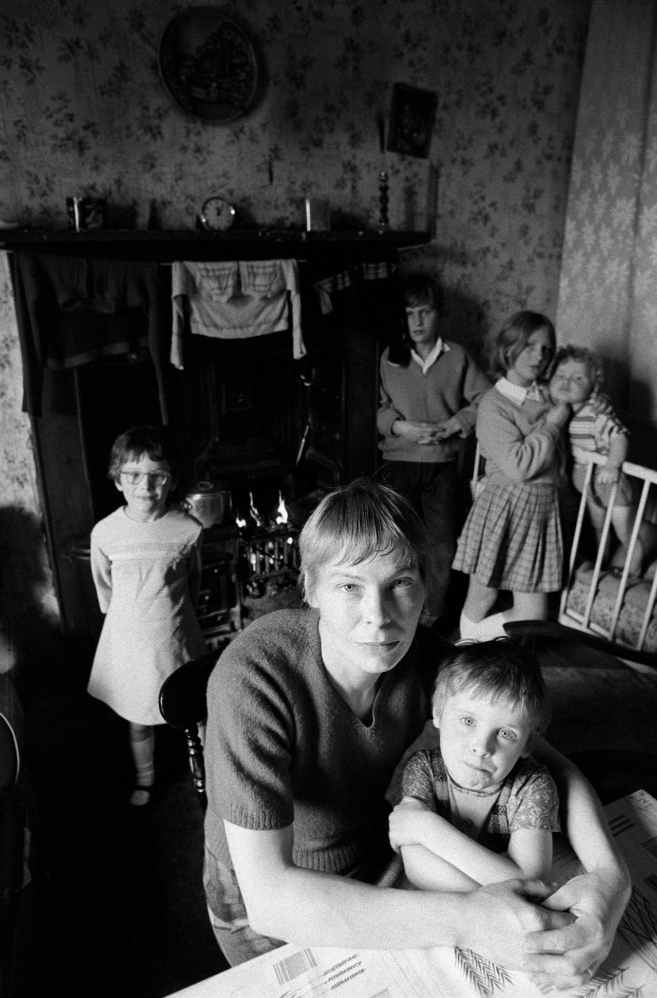 #64 A mother with her five children in poor housing in the notorious Gorbals district of Glasgow, 1969.