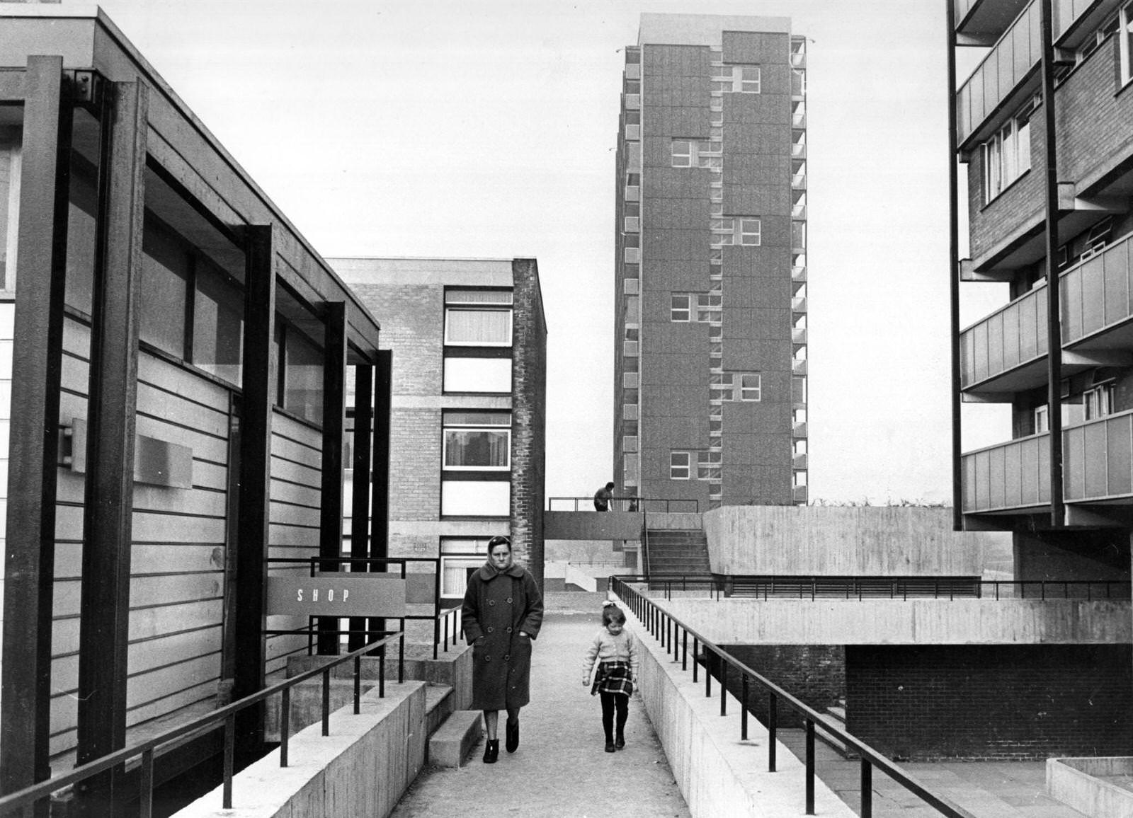#12 A woman and a little girl walking through an area of modern housing in the Gorbals area of Glasgow, 1690