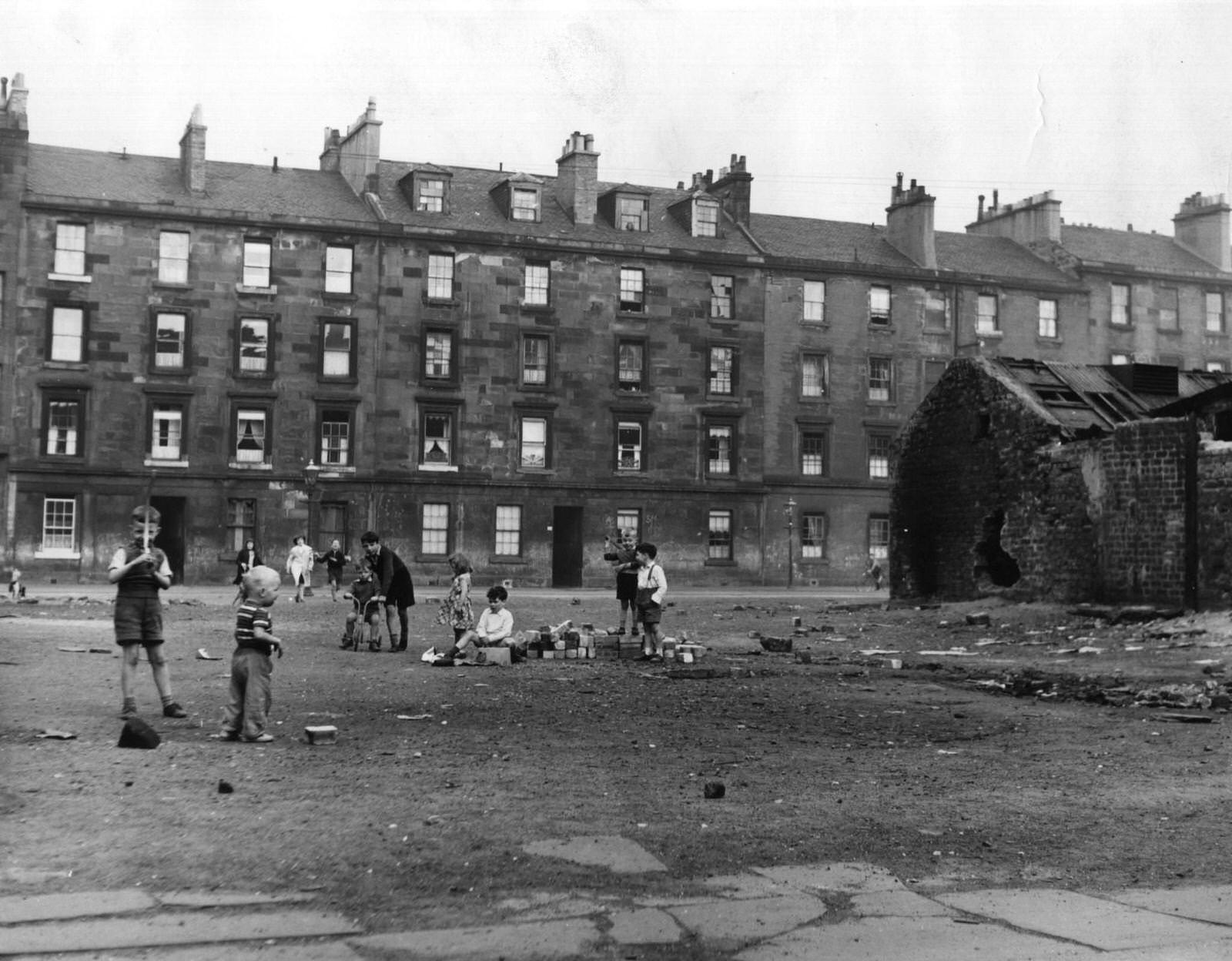 #78 An open site which children in the Gorbals area of Glasgow use for playing, 1961