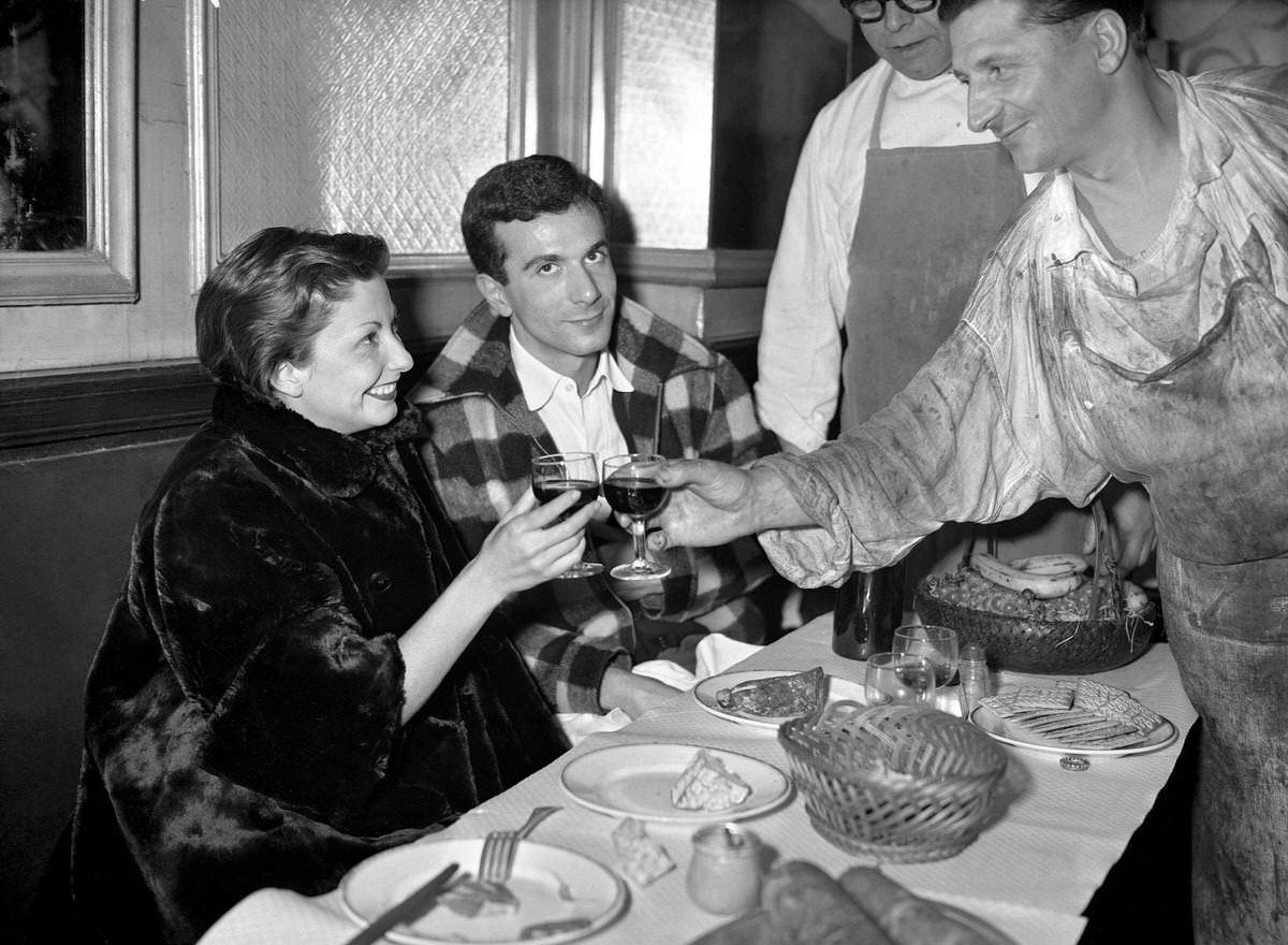 #18 French dancer Zizi Jeanmaire, accompanied by her husband in Les Halles, 1952