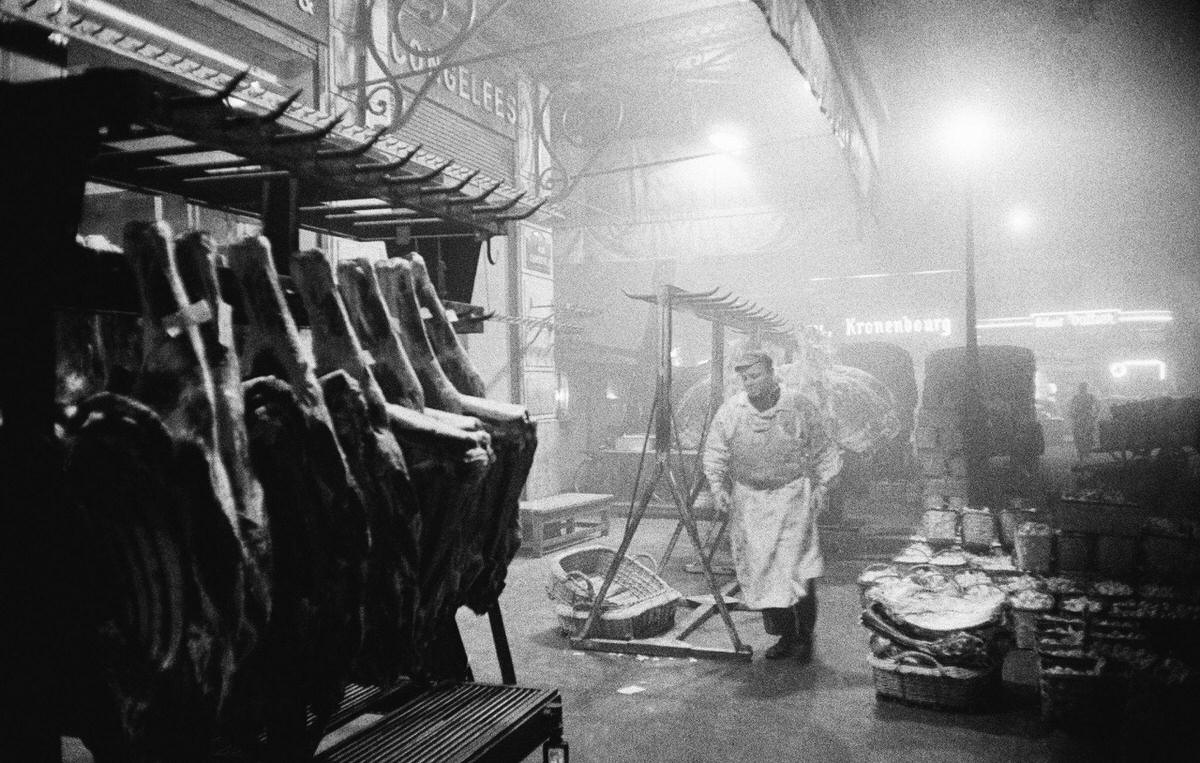 #62 Butcher at work in Les Halles which was the central wholesale market of Paris, 1950