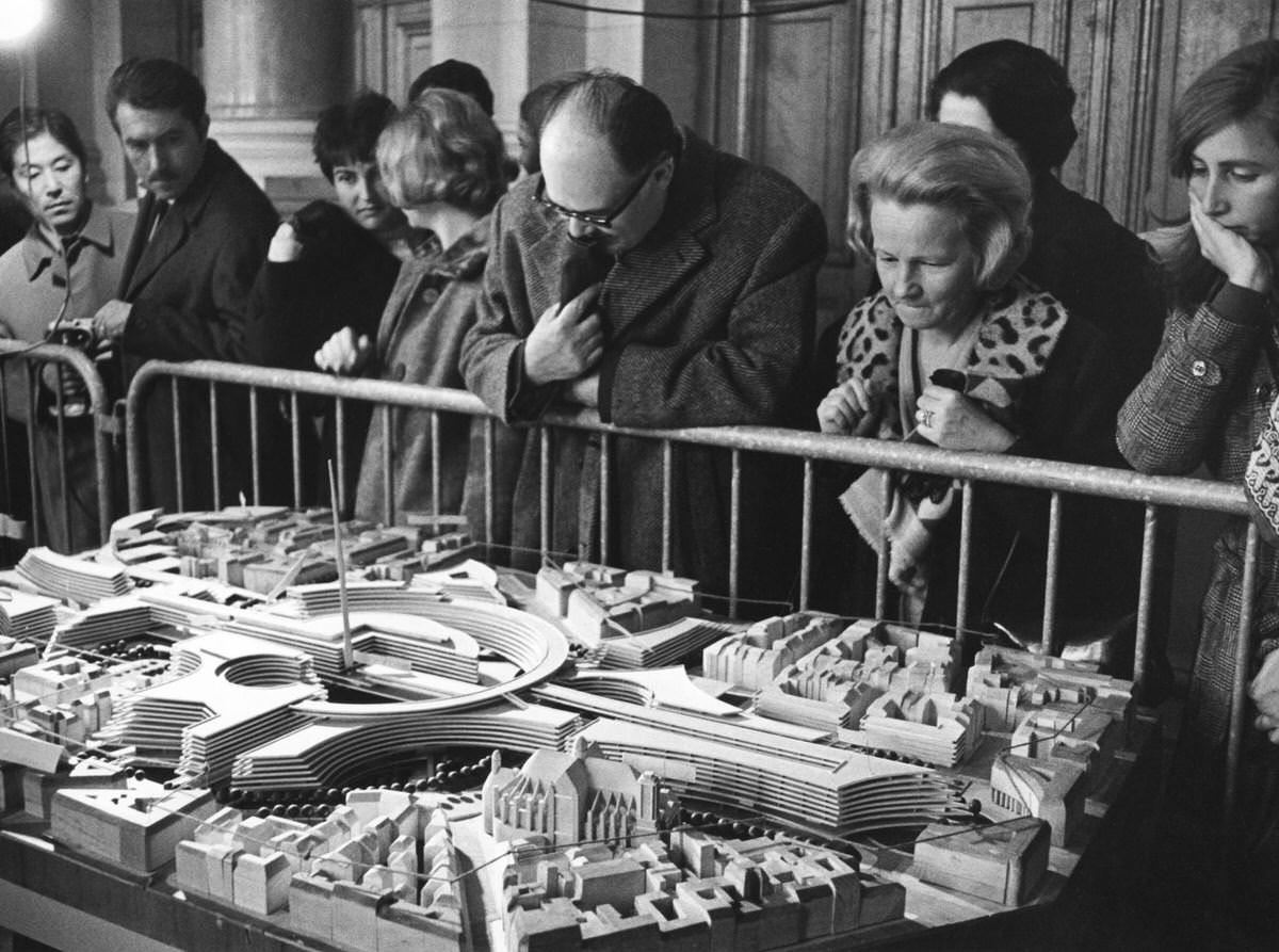 #2 Parisians observing the model of an architectural project for the Les Halles shopping center in Paris, 1960