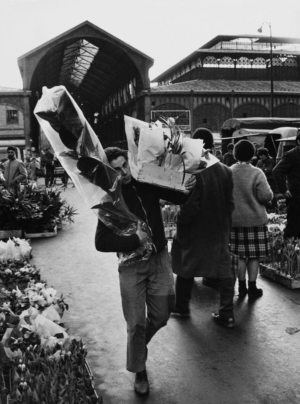 #21 A Man Carrying some bouquets of Flowers, 1960s