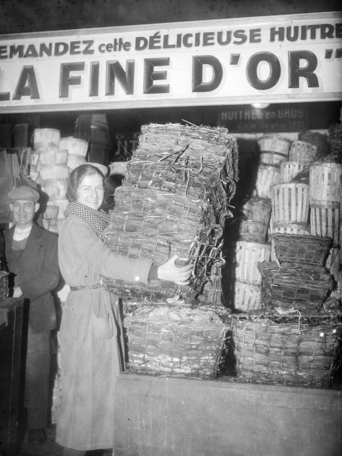 #31 Employee setting up a large shipment of oyster baskets at Les Halles in Paris, France, on December 22, 1934.