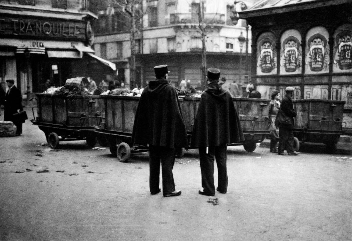 #47 Policemen patrolling Les Halles district ( central food market) at Paris among the workers of the trade, 1931