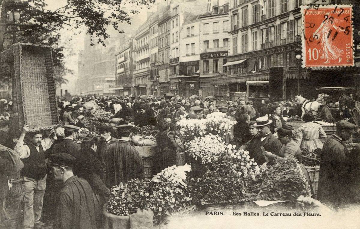#72 A flower stall and street scene outside Les Halles in Paris, 1908.