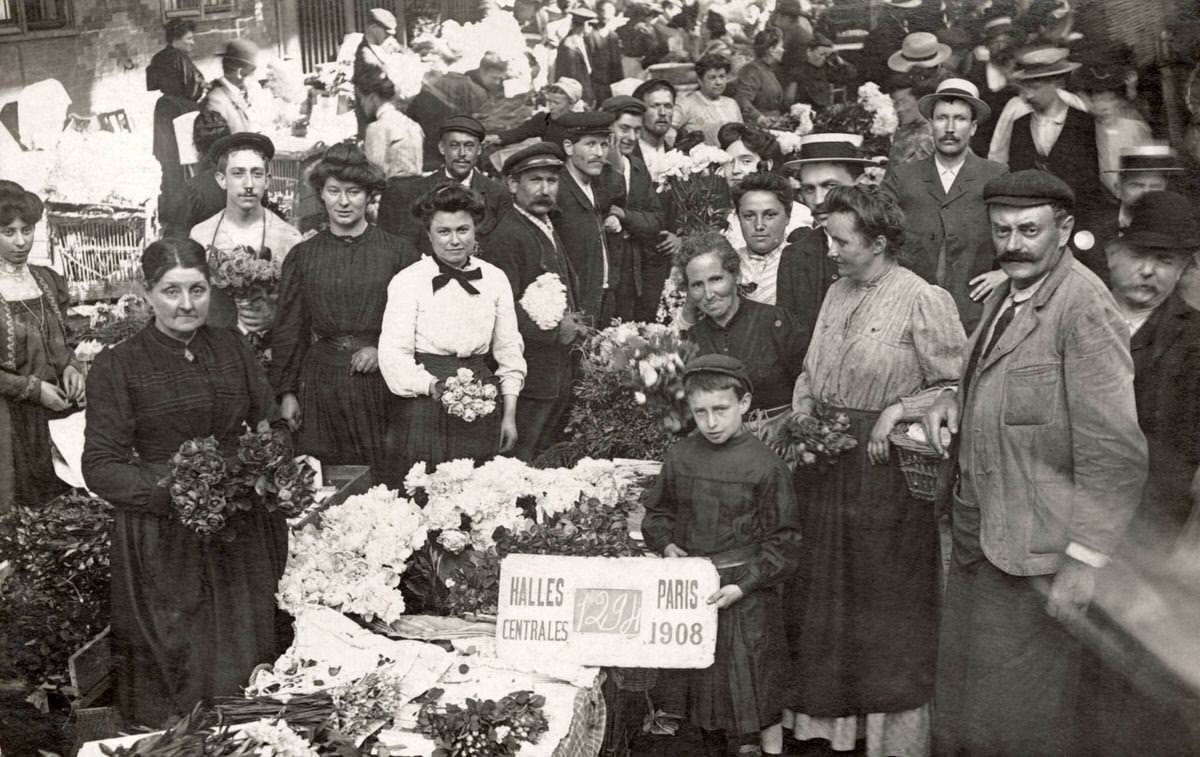 #74 Customers and employees of a market stall selling flowers at Les Halles in Paris, 1908
