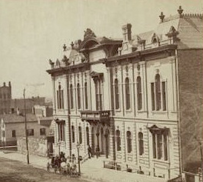 #7 Front of music hall along the road, with a horse and carriage team in front of the entrance, 1880