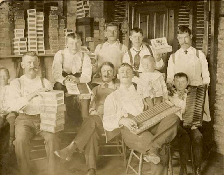 #76 Workers at the Willms cigar factory, Milwaukee, Wisconsin, posing with cigars and cigar boxes, 1896