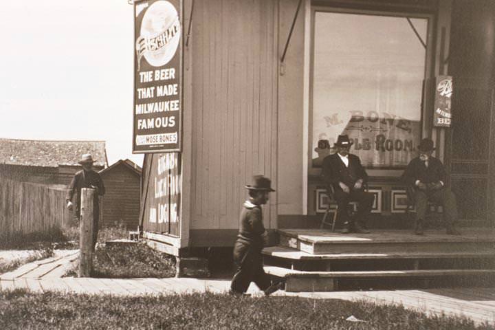 #7 Small sailor walking down boardwalk, 1890
