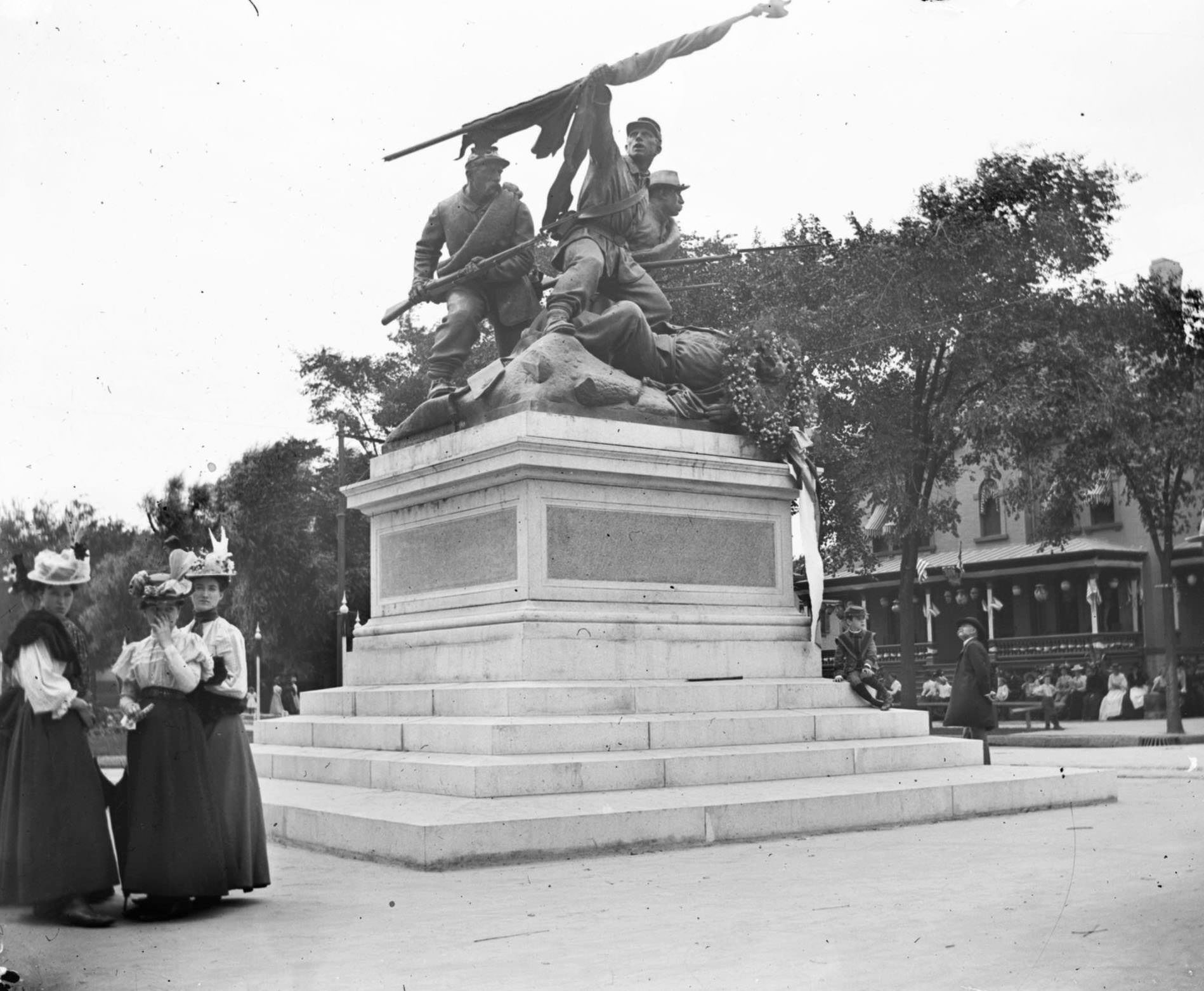 #116 Women congregate near ‘The Victorious Charge,’ a monument to Soldiers who fought in the Civil War located in Milwaukee’s Court of Honor on the median between the lanes of West Wisconsin Avenue, Milwaukee, Wisconsin, 1898.