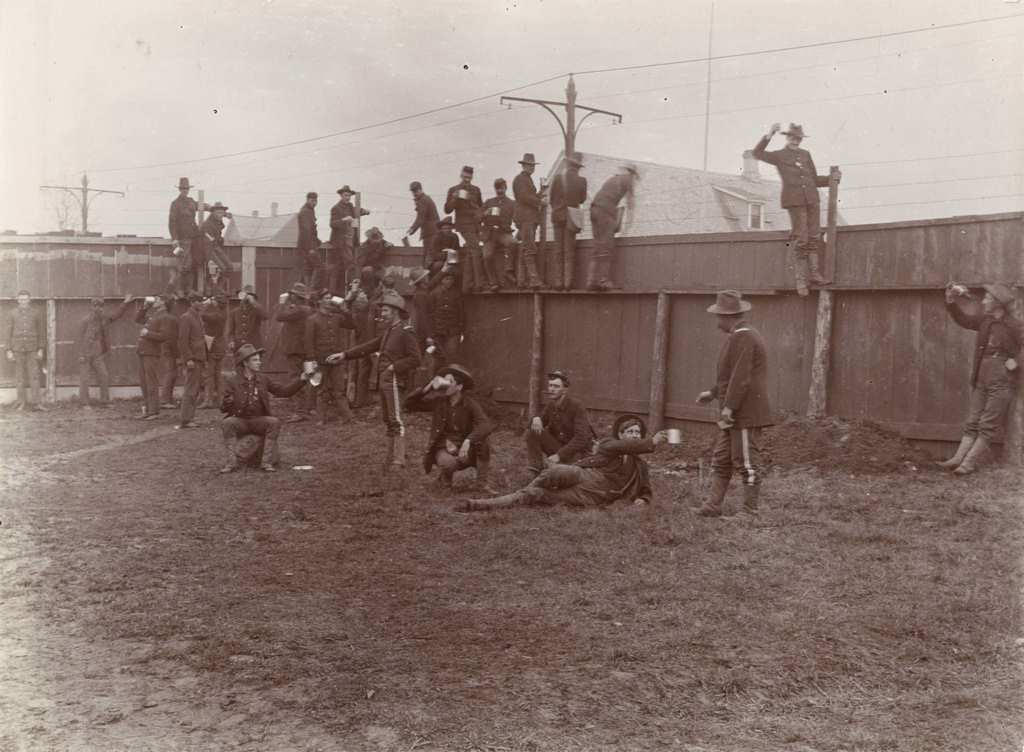 #123 A group of soldiers from Company A, 3rd Regiment, take a break to drink inside the walls of Camp Harvey, Milwaukee, Wisconsin, 1898.