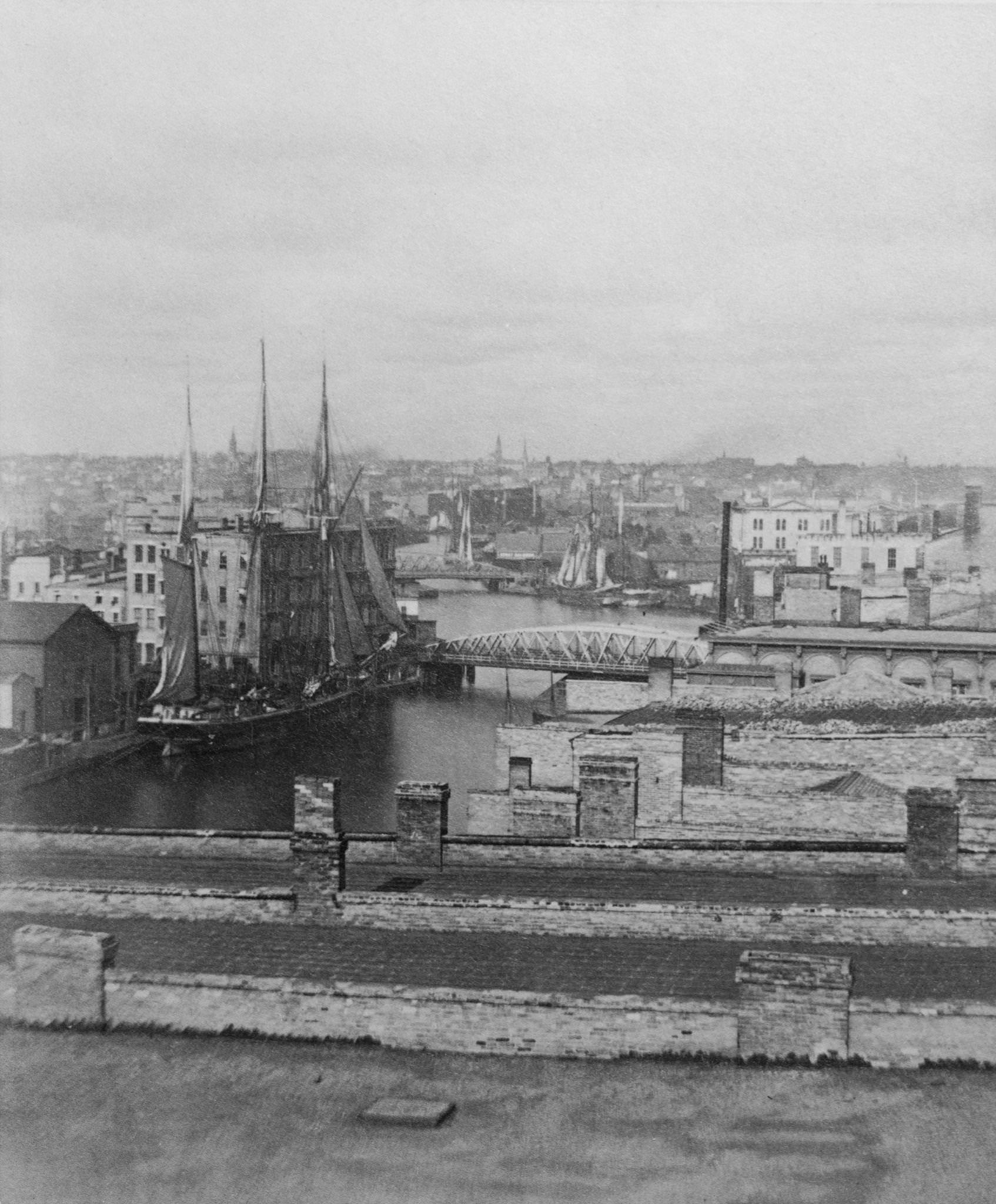 #9 High angle view of a ship moored at a wharf on the Milwaukee River in Milwaukee, Wisconsin, 1875.