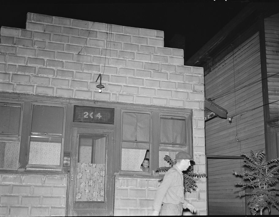 #21 Man leaving prostitute’s house, Peoria, Illinois, 1938