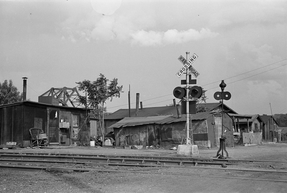 #28 Slums at Cinder Point between railroad and Illinois River, Peoria, Illinois, 1938