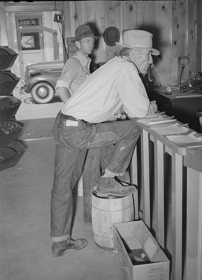 #121 Farmers waiting at the lumber yard office of the United Producers and Consumers Cooperative, Phoenix, Arizona, 1940