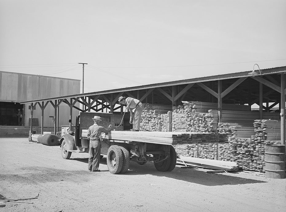#122 Lumber being loaded onto truck at the Producers and Consumers Cooperative, Phoenix, Arizona, 1940