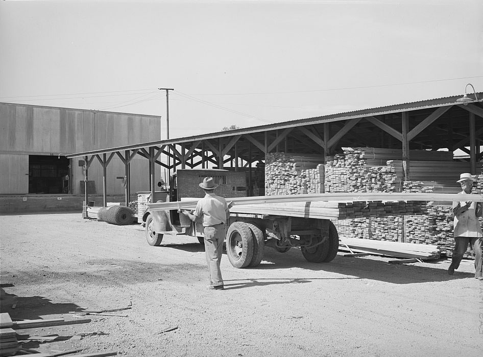 #124 Untitled photo, possibly related to: Lumber being loaded onto truck at the Producers and Consumers Cooperative, Phoenix, Arizona, 1940