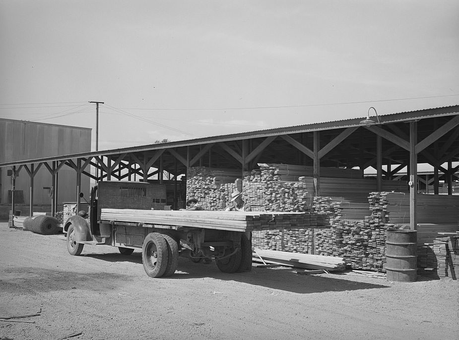 #128 Lumber being loaded onto truck at the Producers and Consumers Cooperative, Phoenix, Arizona, 1940