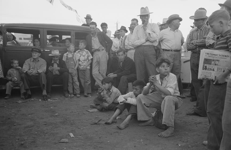 #135 Audience listening to orchestra playing outside grocery store on Saturday afternoon, Phoenix, Arizona, 1940