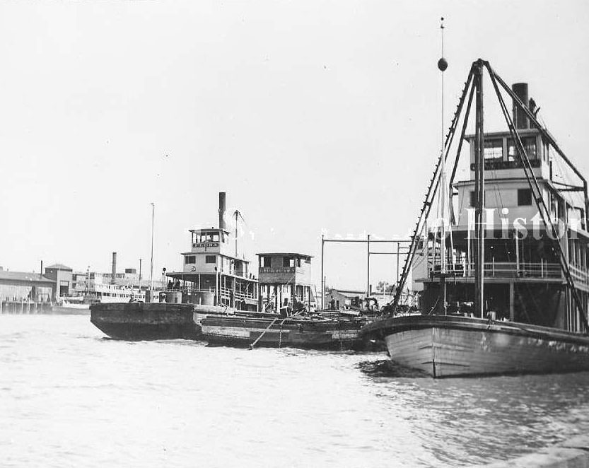 #7 Sacramento River waterfront with the river boats “San Joaquin” and “Flora” and the barge, “Rio Vista”, 1880s