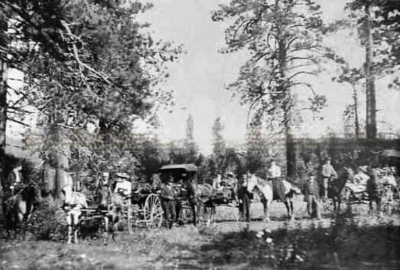 #5 Exterior view of Samuel Luke Howe, Sr. camping in Nevada Scene shows people on horseback and horse drawn carriages, 1880
