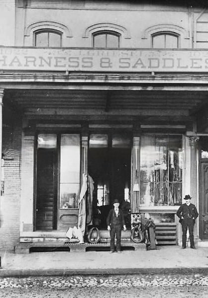 #141 Jacob Griesel poses in front of his harness shop at 1022 J Street, 1887