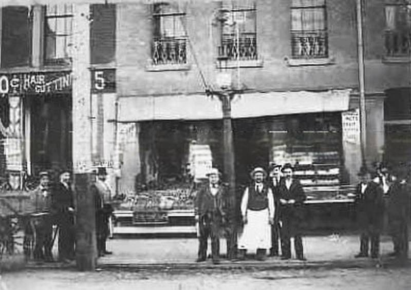 #152 The storefront of two businesses, 1885